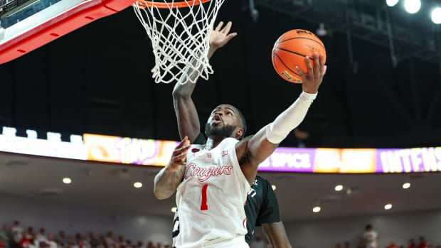 Houston Cougars guard Jamal Shead (1) shoots the ball during the second half against the Cincinnati Bearcats at Fertitta Center in Houston, Texas, Feb. 27, 2024.